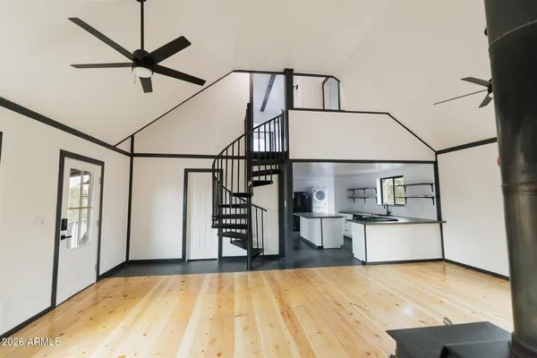 a view of a hallway with closet and bathroom
