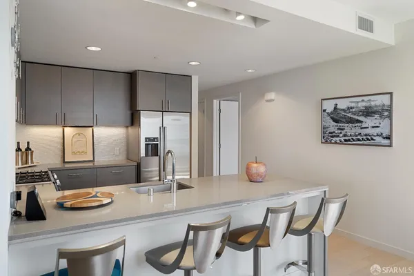 a kitchen with a sink cabinets and window