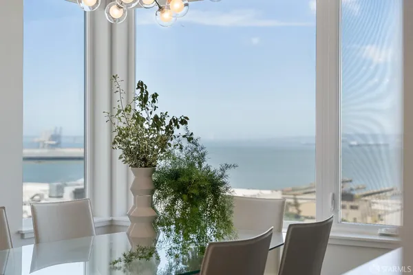 a view of a chair and table in the room