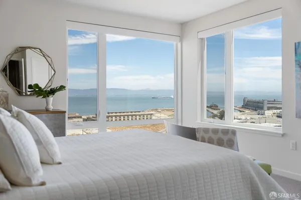 a bedroom with a bed and window