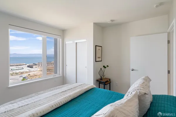 a bed room with a bed and a window
