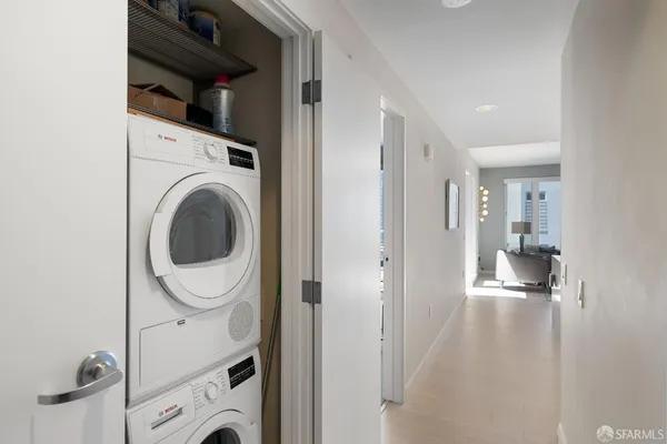 a view of a hallway with washer and dryer