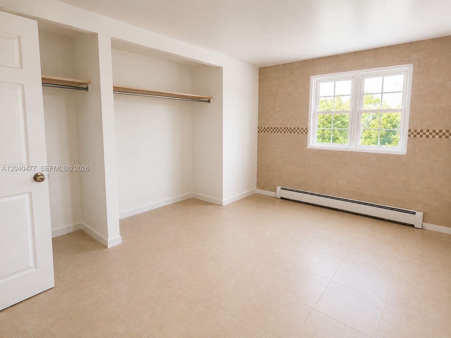 9110 Southwest 44th Street Miami, FL 33165 - Photo 15 of 18 an empty room with a window
