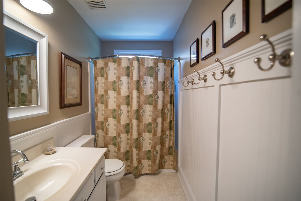 9716 Talman Court Raleigh, NC 27615 - Photo 22 of 30 Hall bath features tub/shower combo and vanity. Bathroom