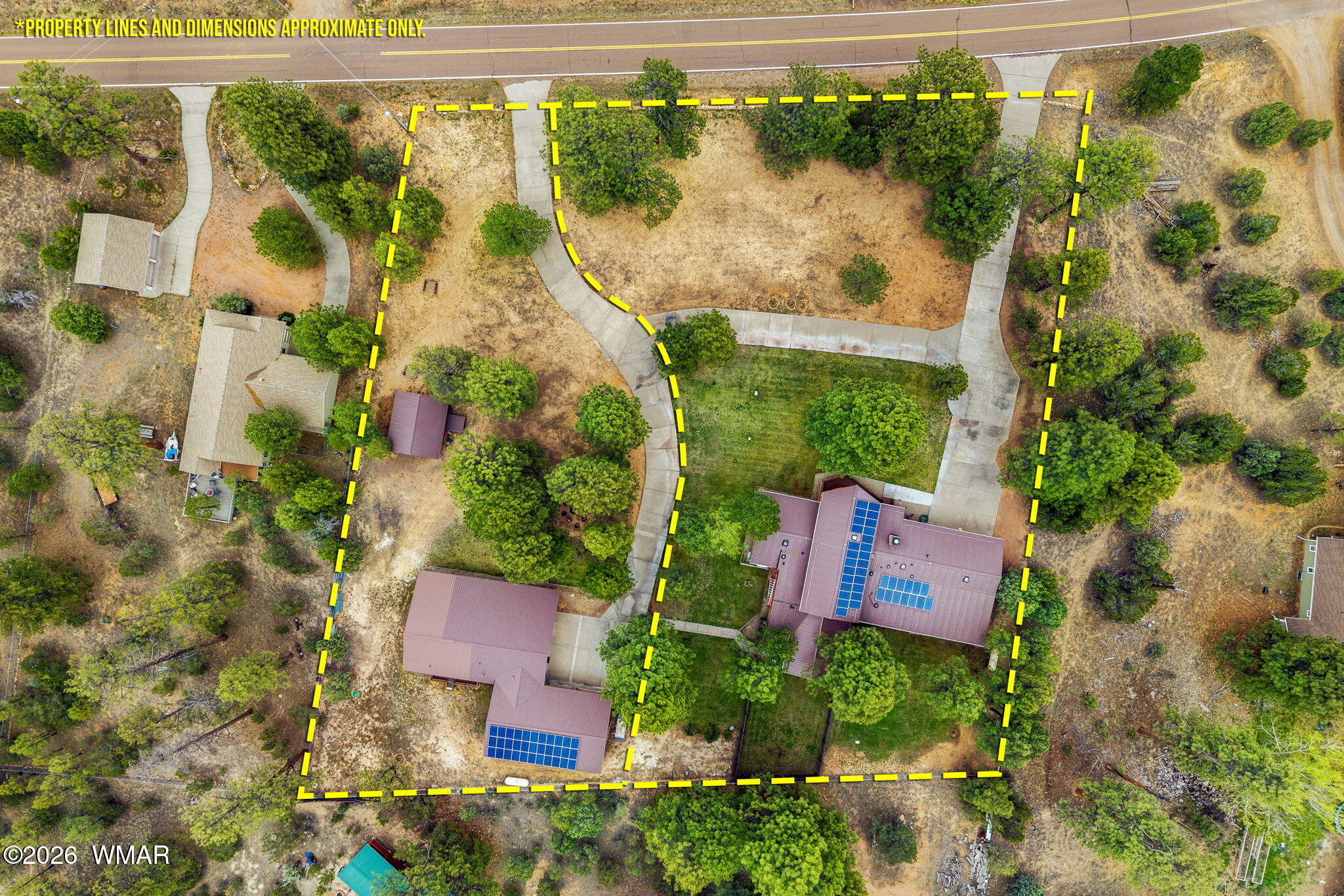 2922 Pine Rim Road Overgaard, AZ 85933 - Photo 55 of 58 an aerial view of a house with a garden and yard
