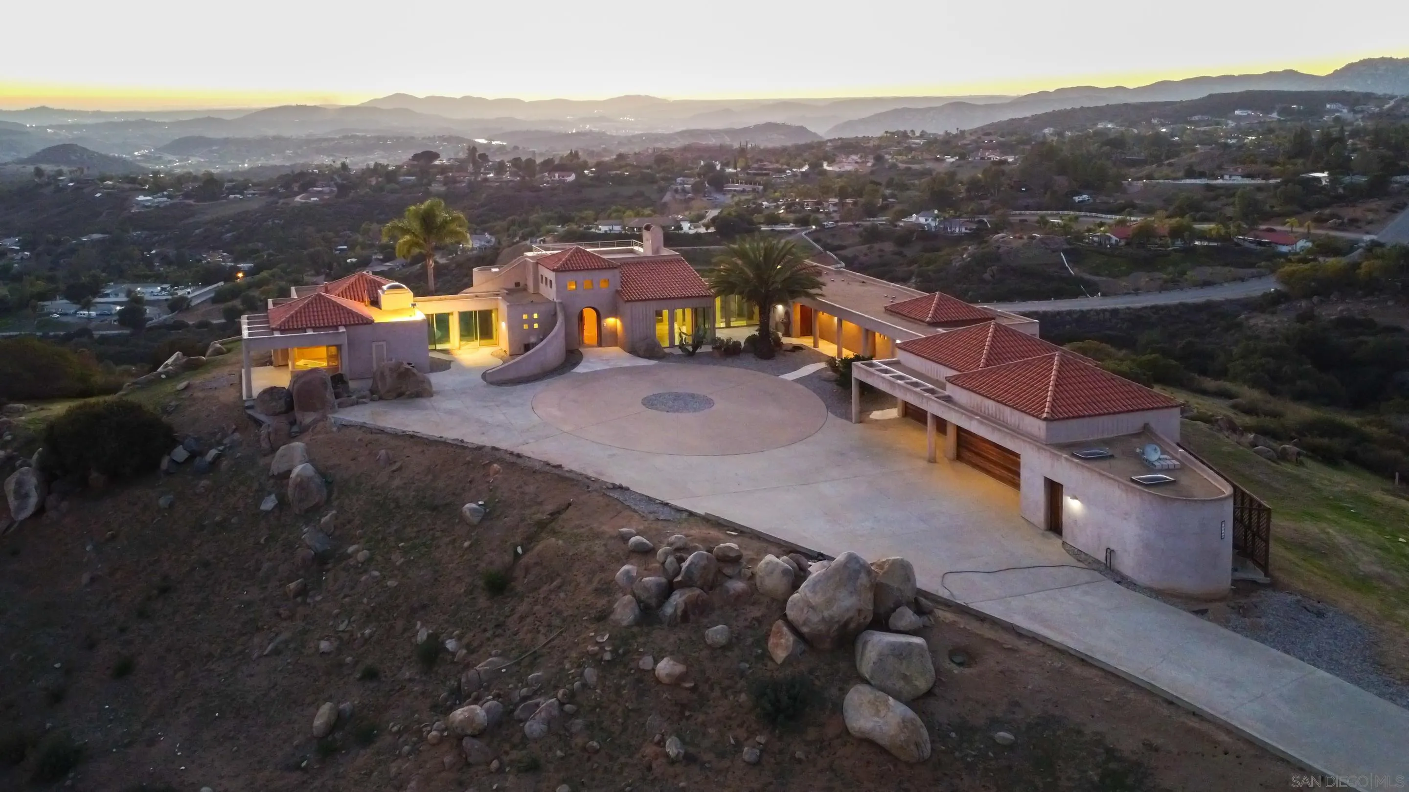 a view of a town with mountains in the background