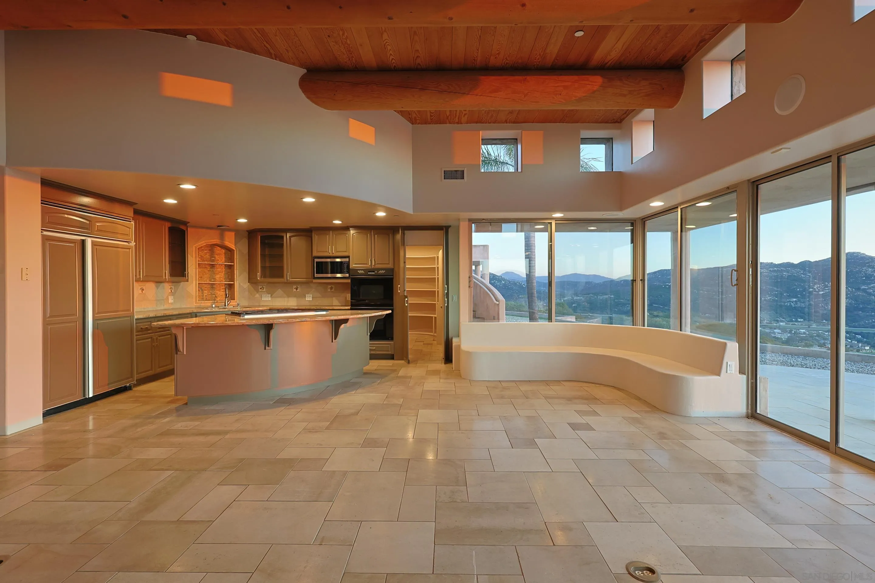15740 Broad Oaks Road El Cajon, CA 92021 - Photo 11 of 47 a large room with stainless steel appliances kitchen island granite countertop a large kitchen counter top and a stove