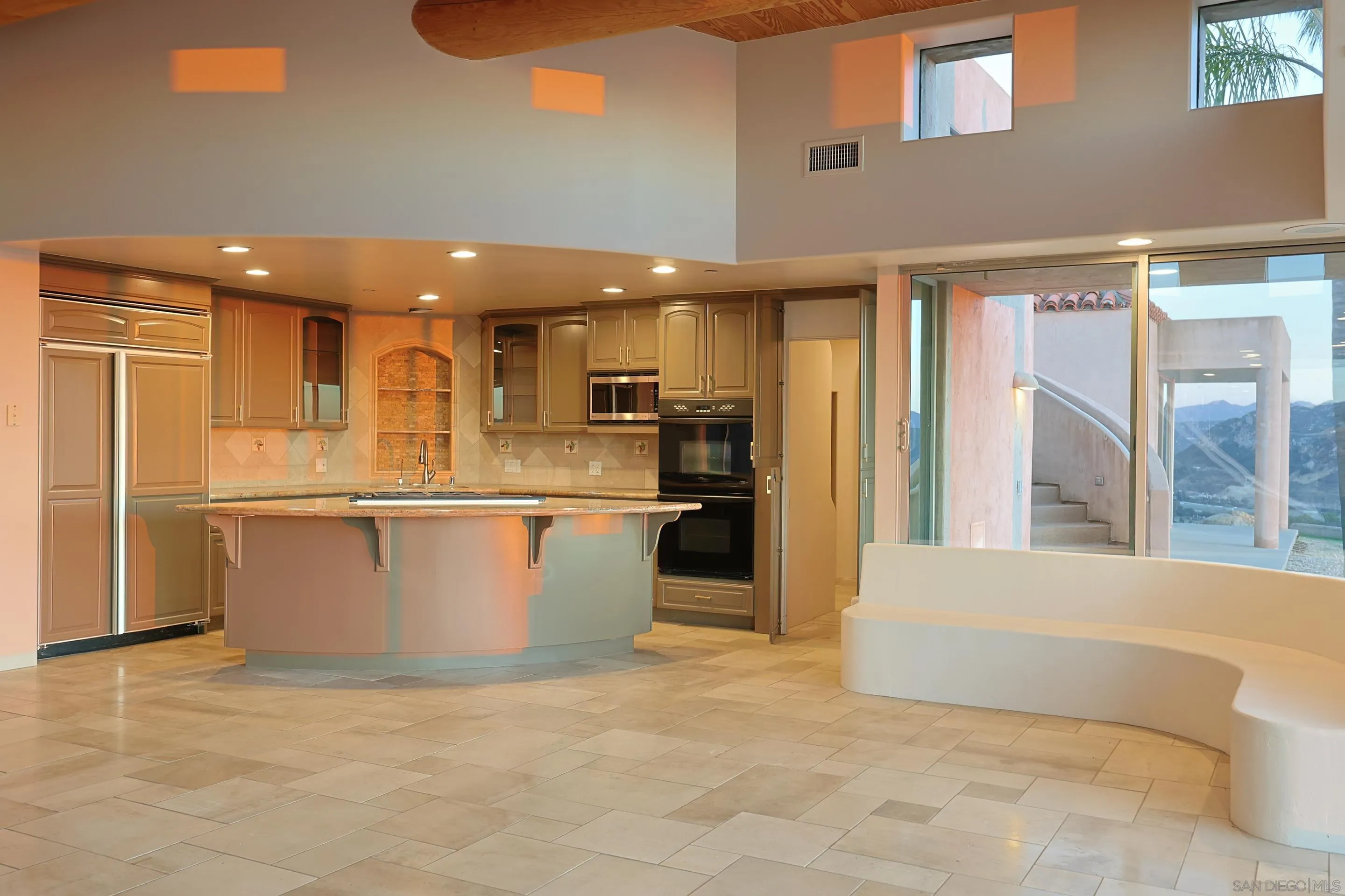 15740 Broad Oaks Road El Cajon, CA 92021 - Photo 12 of 47 a large white kitchen with a large window