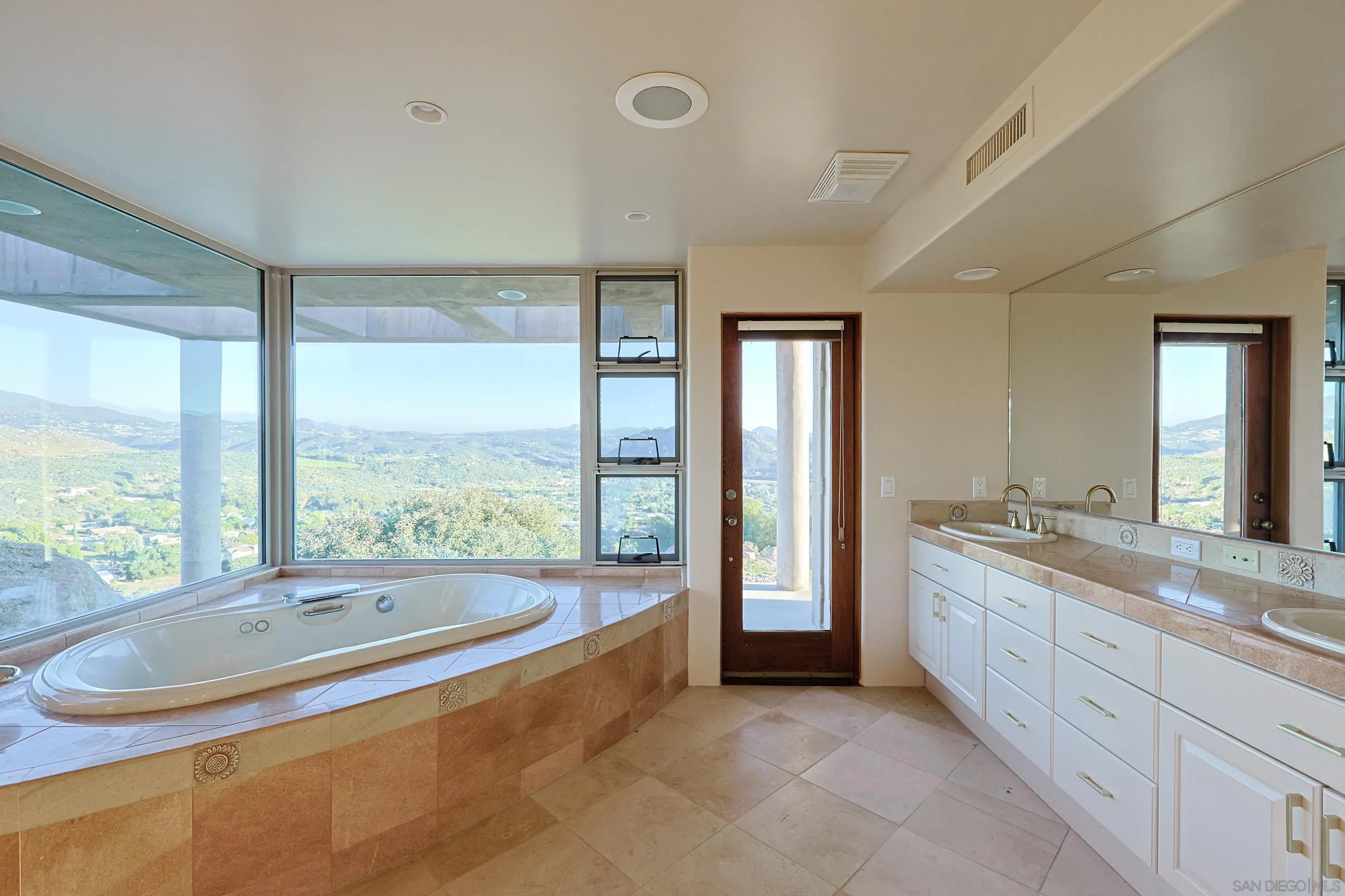 15740 Broad Oaks Road El Cajon, CA 92021 - Photo 19 of 47 a spacious bathroom with a large tub and sink