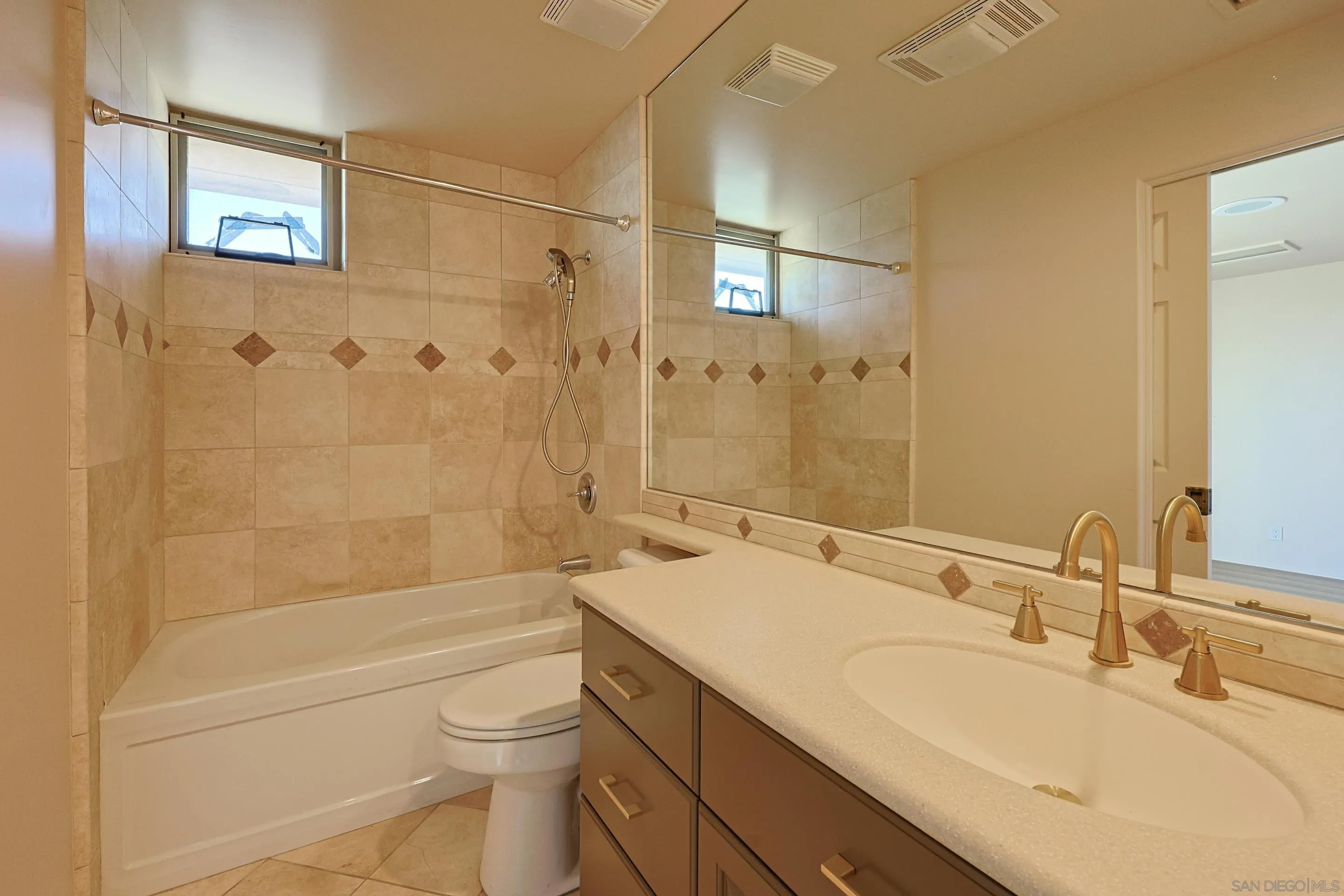 15740 Broad Oaks Road El Cajon, CA 92021 - Photo 22 of 47 a bathroom with a granite countertop sink a toilet and shower