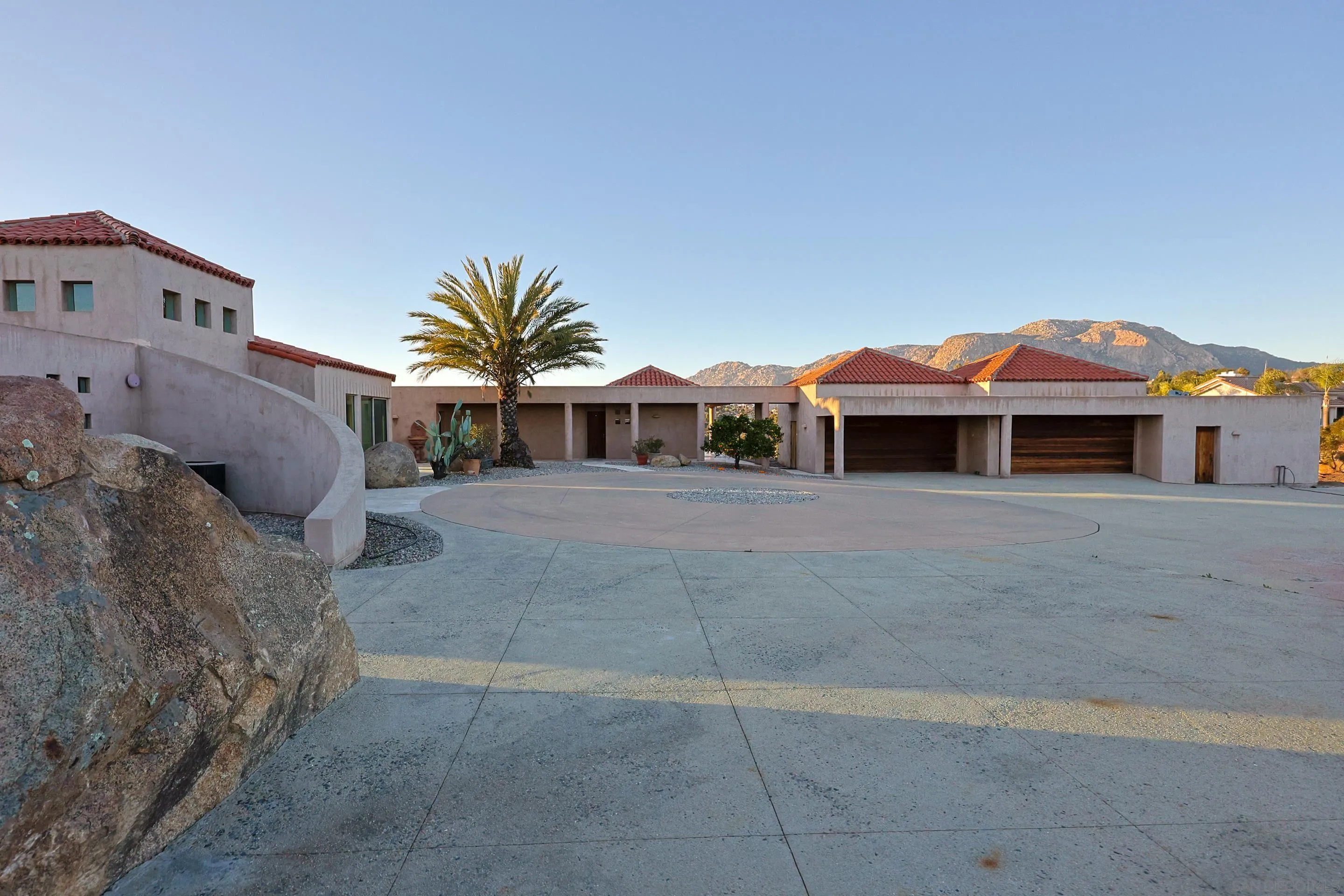 15740 Broad Oaks Road El Cajon, CA 92021 - Photo 38 of 47 a front view of a house with a yard and garage