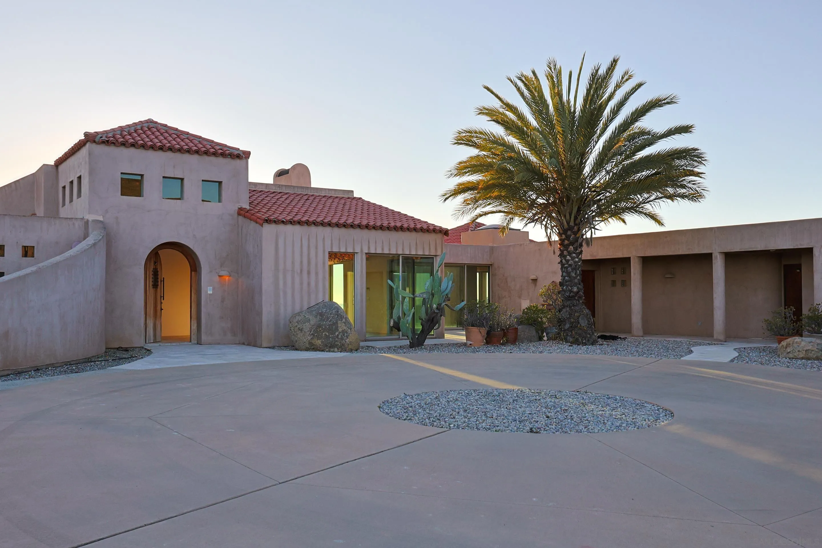 15740 Broad Oaks Road El Cajon, CA 92021 - Photo 5 of 47 a front view of a house with a yard and garage