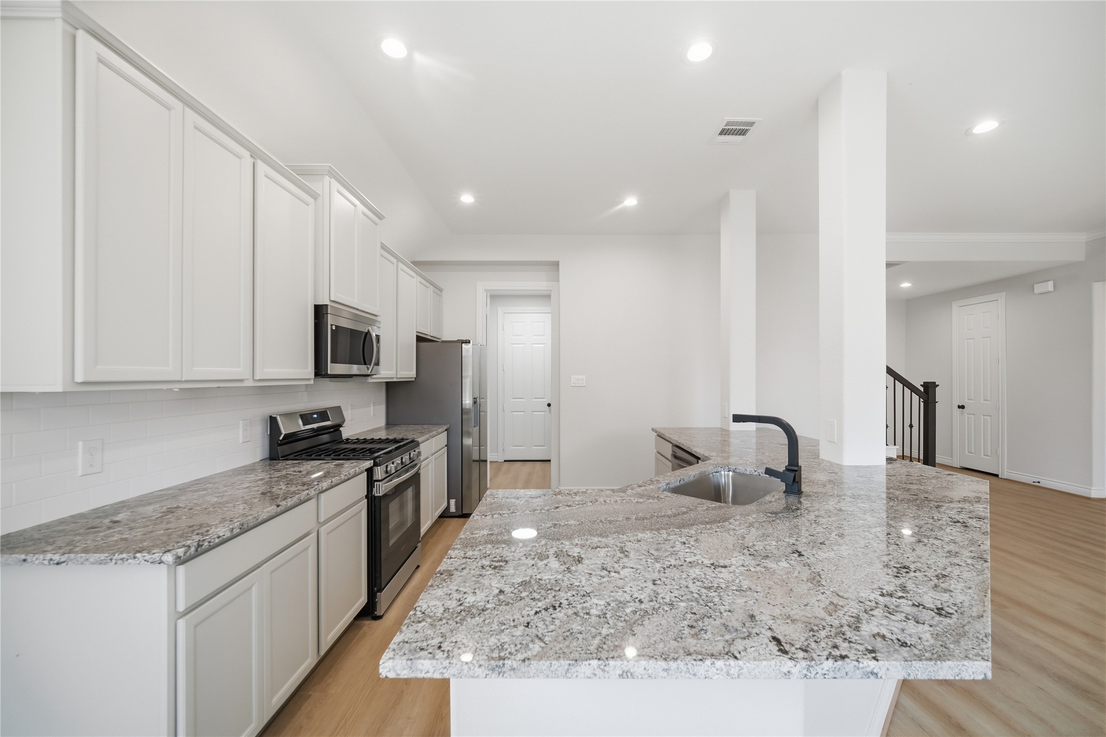 114 Par Circle La Porte, TX 77571 - Photo 13 of 33 The Kitchen offers granite countertops, recessed lighting, and ample cabinetry, the kitchen is both stylish and functional.