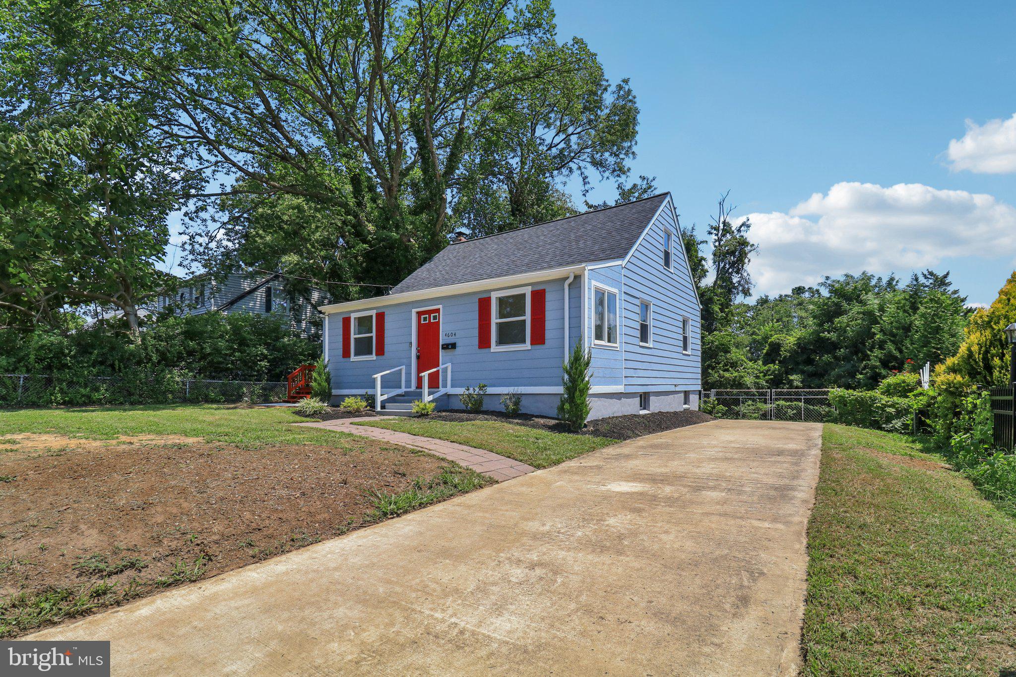 4604 Morgan Road Suitland, MD 20746 - Photo 1 of 38 a view of a yard in front of a house with large trees