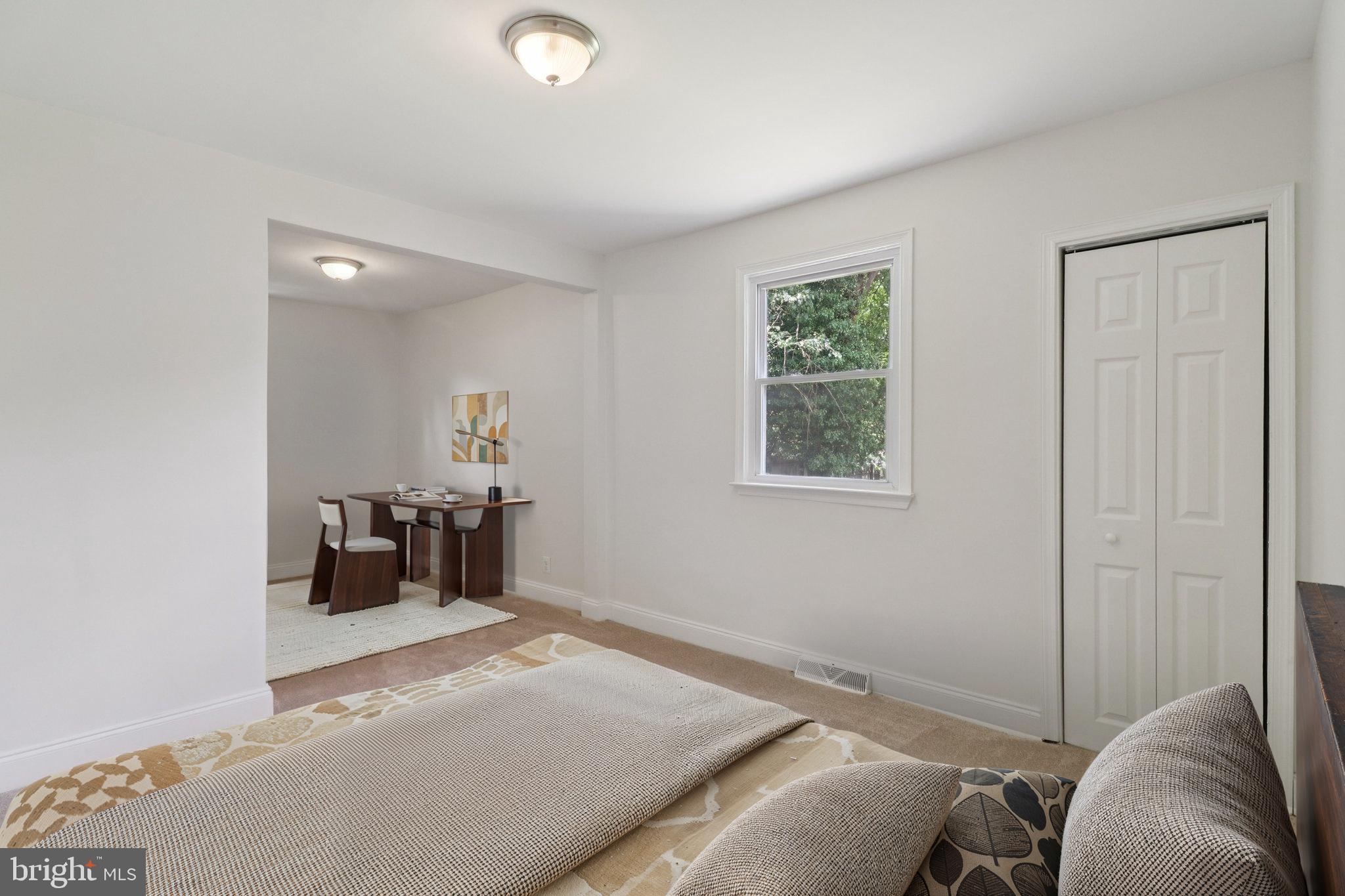 4604 Morgan Road Suitland, MD 20746 - Photo 17 of 38 a bedroom with a bed and a window