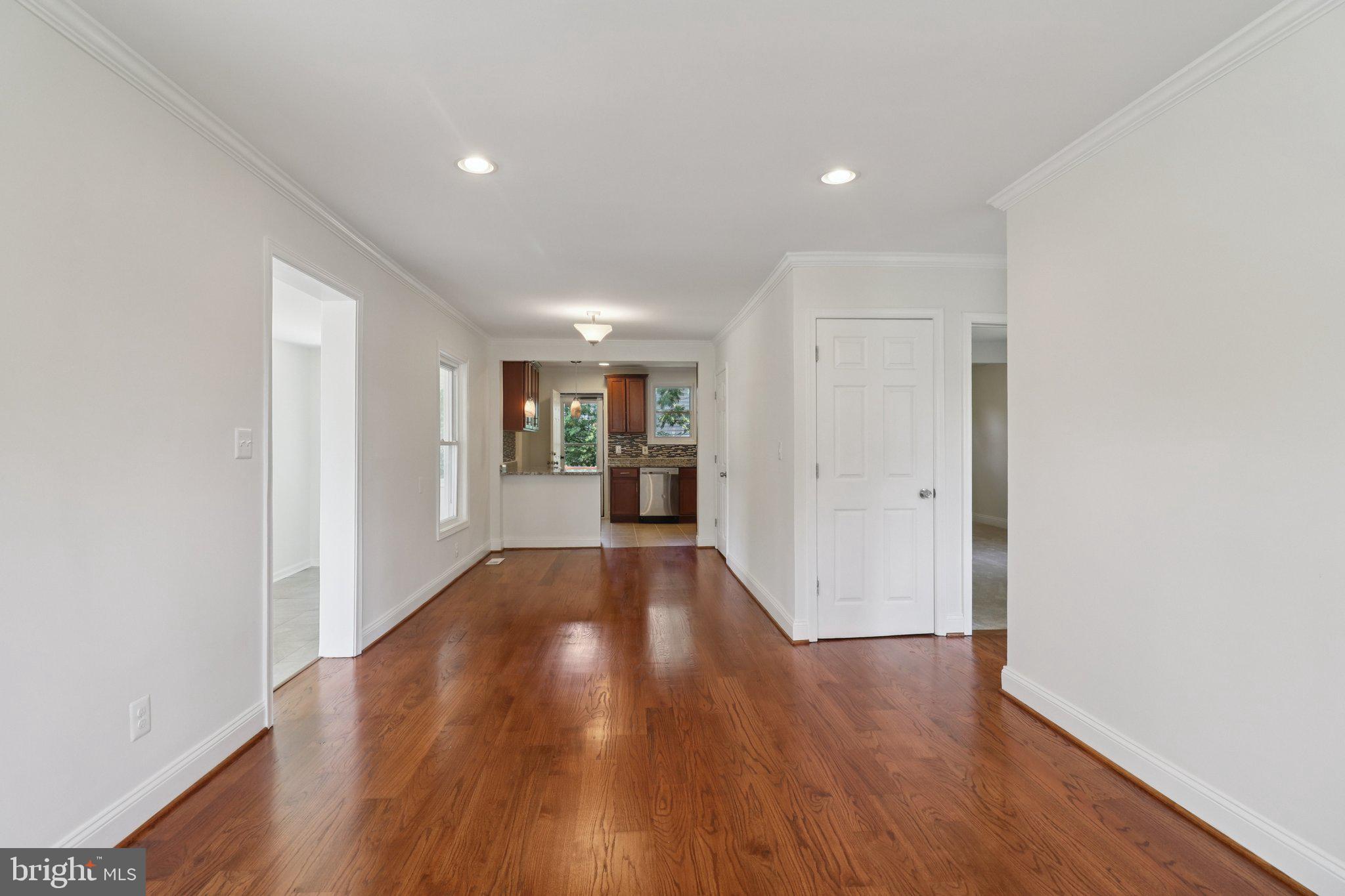4604 Morgan Road Suitland, MD 20746 - Photo 5 of 38 a view of a big room with wooden floor and windows