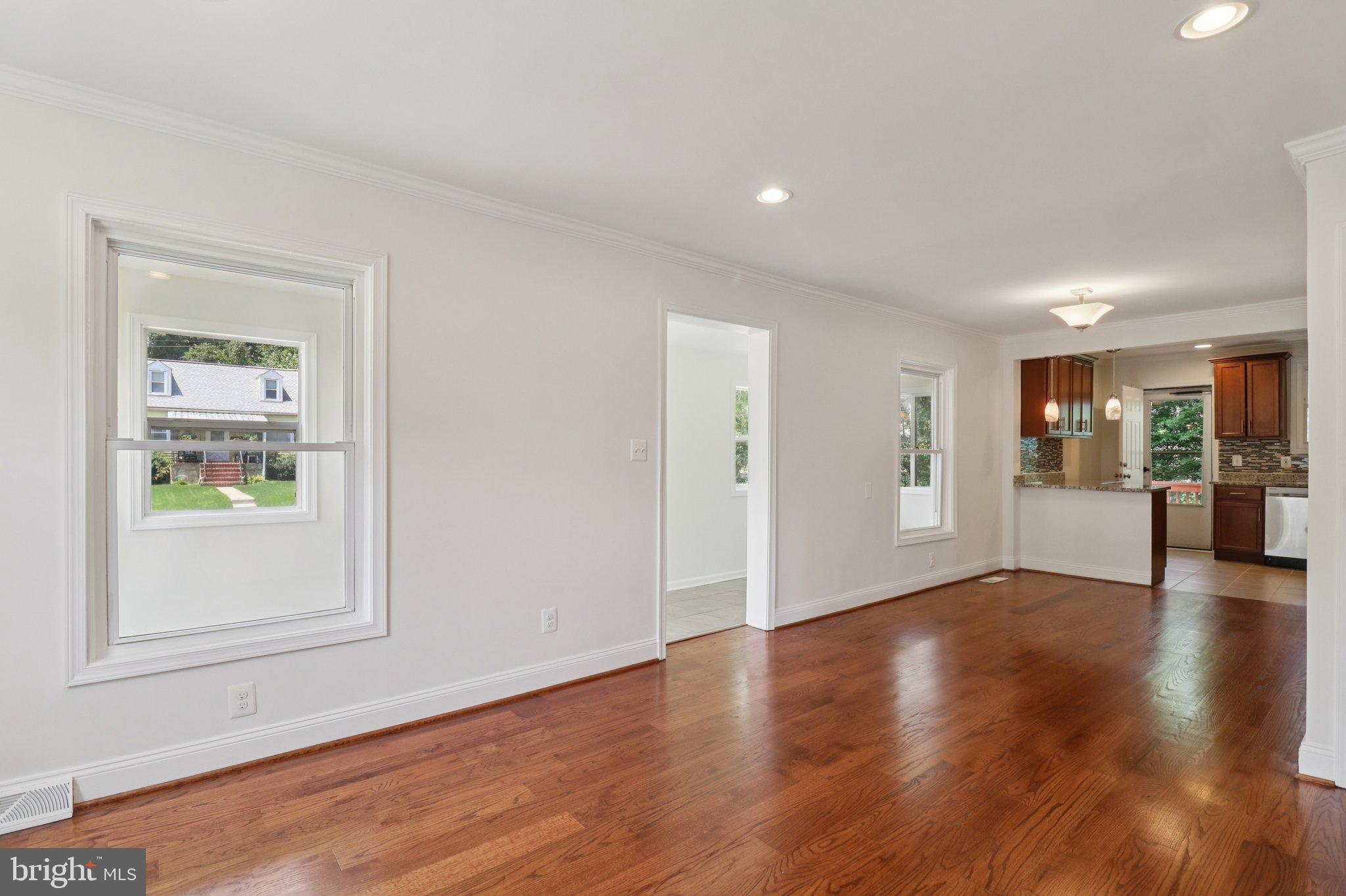 4604 Morgan Road Suitland, MD 20746 - Photo 6 of 38 a view of an empty room with wooden floor and a window