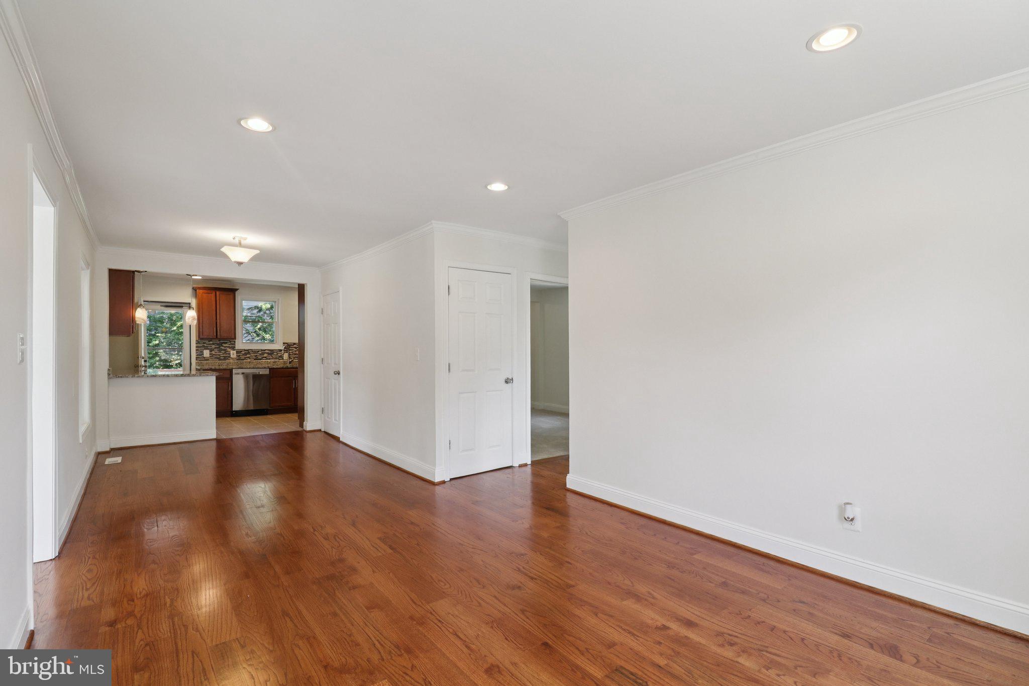 4604 Morgan Road Suitland, MD 20746 - Photo 7 of 38 a view of an empty room with wooden floor and a window