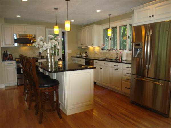12 Red Barn Road Wayland, MA 01778 - Photo 4 of 16 a kitchen with refrigerator cabinets dining table and chairs