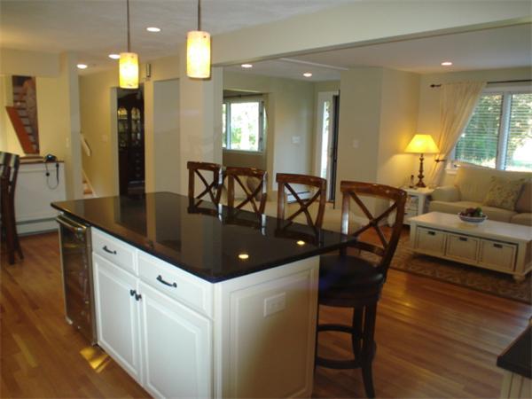 12 Red Barn Road Wayland, MA 01778 - Photo 5 of 16 a kitchen with a dining table chairs and sink