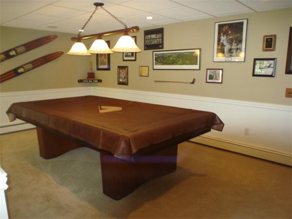 12 Red Barn Road Wayland, MA 01778 - Photo 8 of 16 a room with a bed and a chandelier