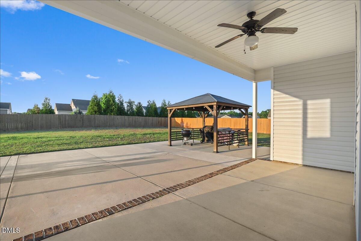 88 Heath Road Lillington, NC 27546 - Photo 22 of 54 a view of swimming pool with a yard and seating space