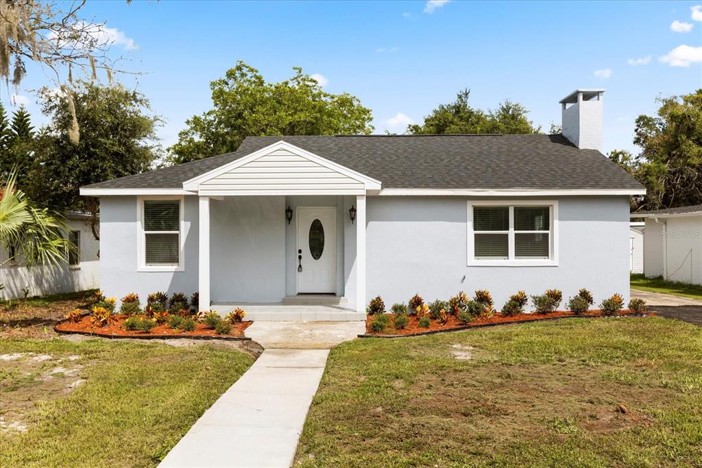 504 South 12th Street Leesburg, FL 34748 - Photo 1 of 1 a front view of a house with garden