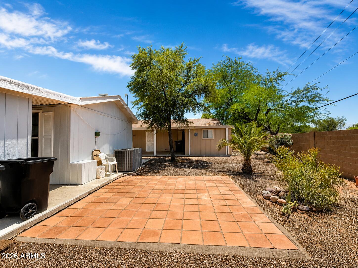 201 South Greenfield Road, Unit 11 Mesa, AZ 85206 - Photo 17 of 22 a view of a backyard with plants and a patio