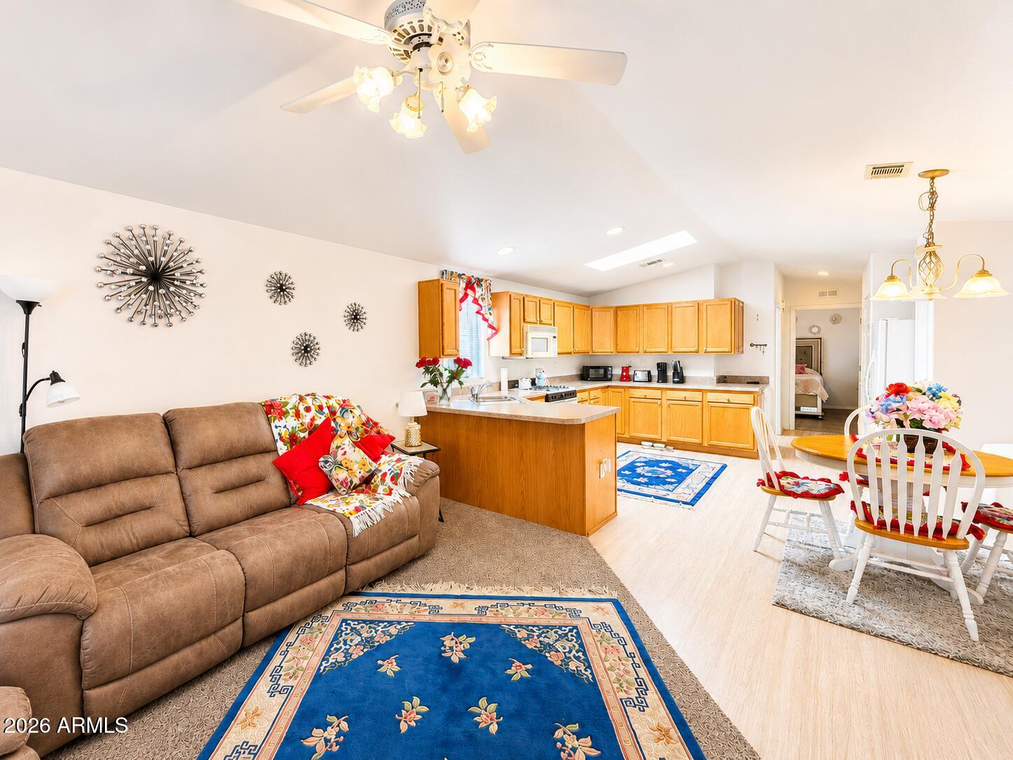 201 South Greenfield Road, Unit 11 Mesa, AZ 85206 - Photo 21 of 22 a living room with furniture and kitchen view