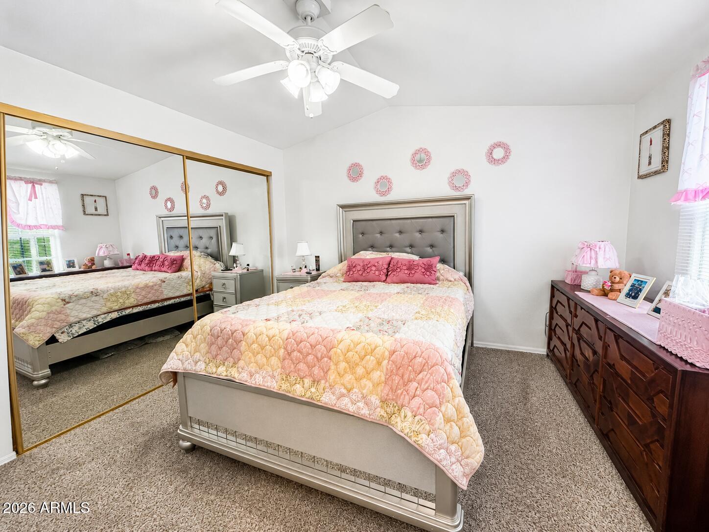 201 South Greenfield Road, Unit 11 Mesa, AZ 85206 - Photo 3 of 22 a spacious bedroom with two bed and a chandelier