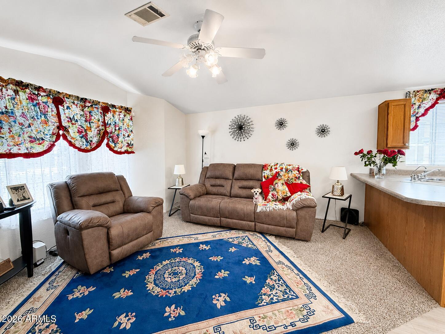 201 South Greenfield Road, Unit 11 Mesa, AZ 85206 - Photo 7 of 22 a living room with furniture and a rug