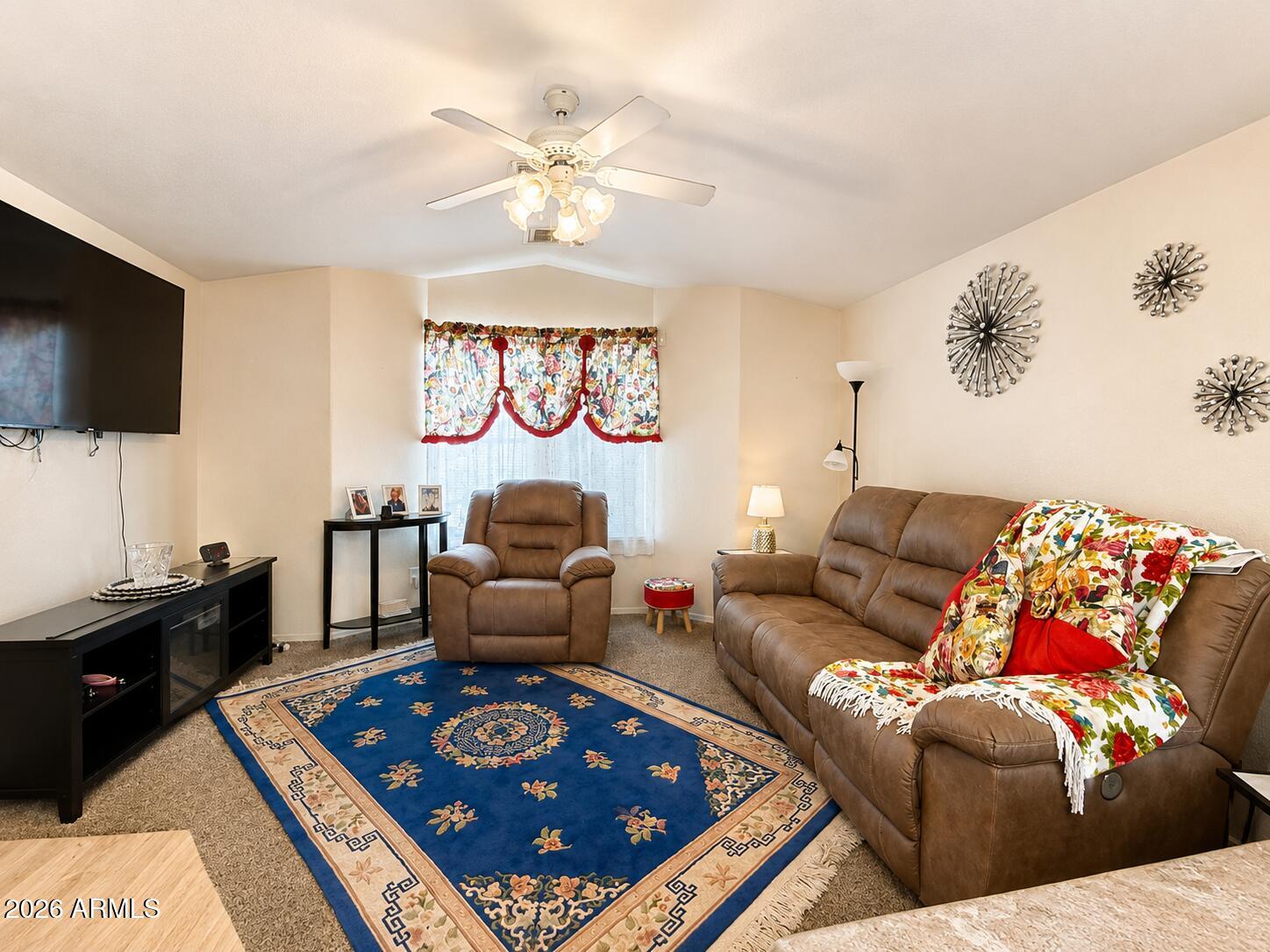 201 South Greenfield Road, Unit 11 Mesa, AZ 85206 - Photo 8 of 22 a living room with furniture and a flat screen tv