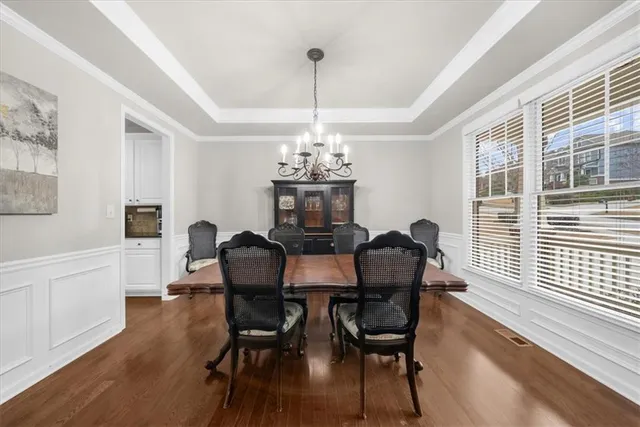 a spacious bedroom with a bed and a fireplace
