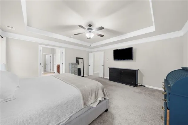 a large bathroom with a tub a double vanity sink and mirrors