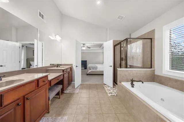a bathroom with a sink a toilet and shower curtain