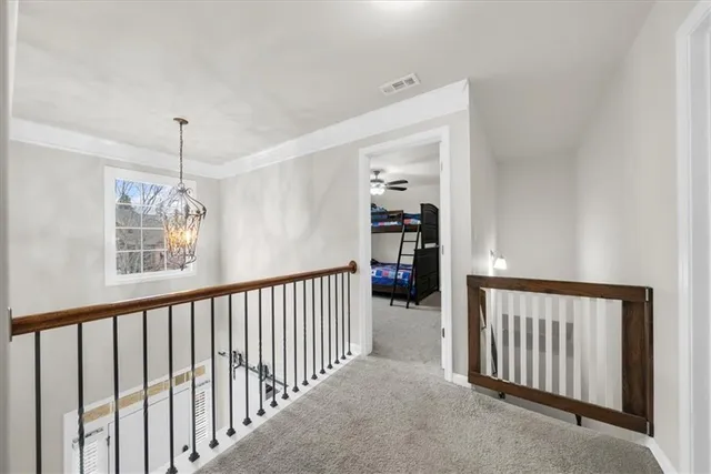 a children room with toys and a chandelier