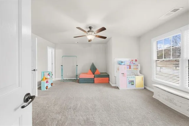 a view of an empty room with stairs