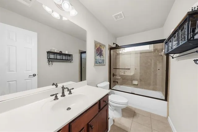 a roof deck with table and chairs and wooden floor