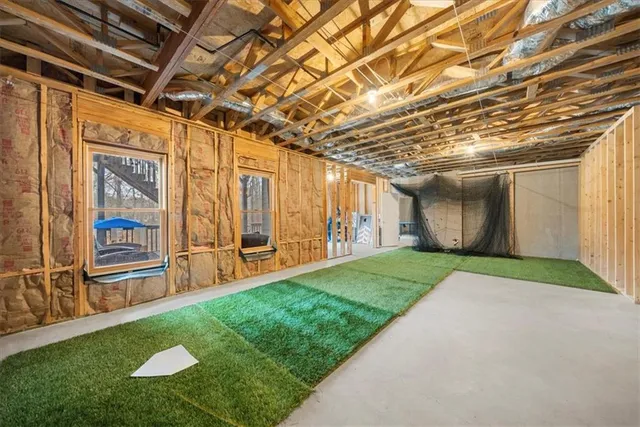 an aerial view of a house with swimming pool a yard and outdoor seating