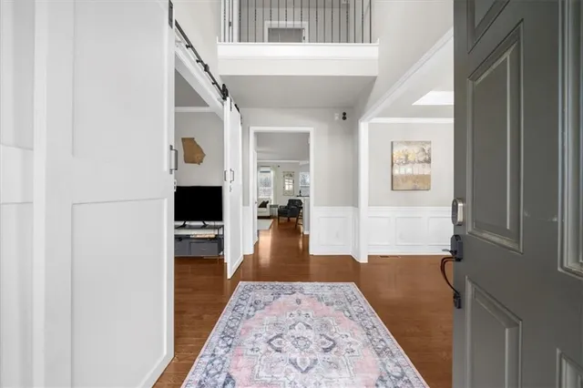 a view of a dining room with furniture window and wooden floor