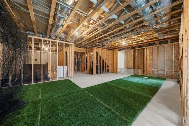 an aerial view of house with swimming pool outdoor seating and yard
