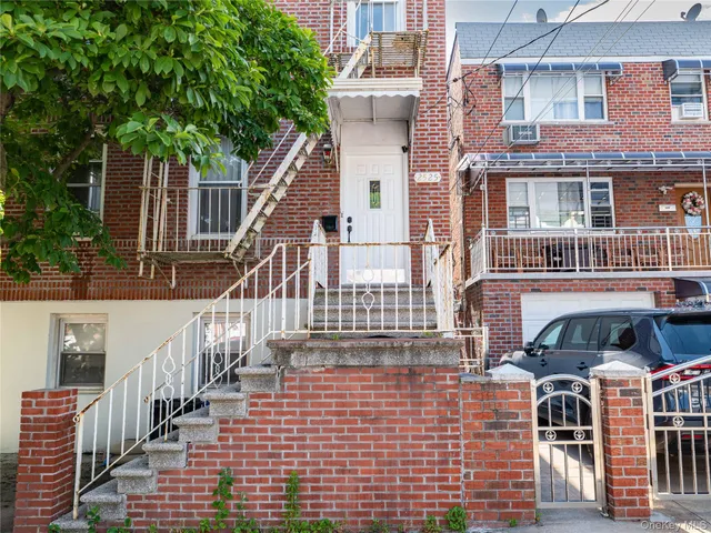 a view of a brick house with many windows