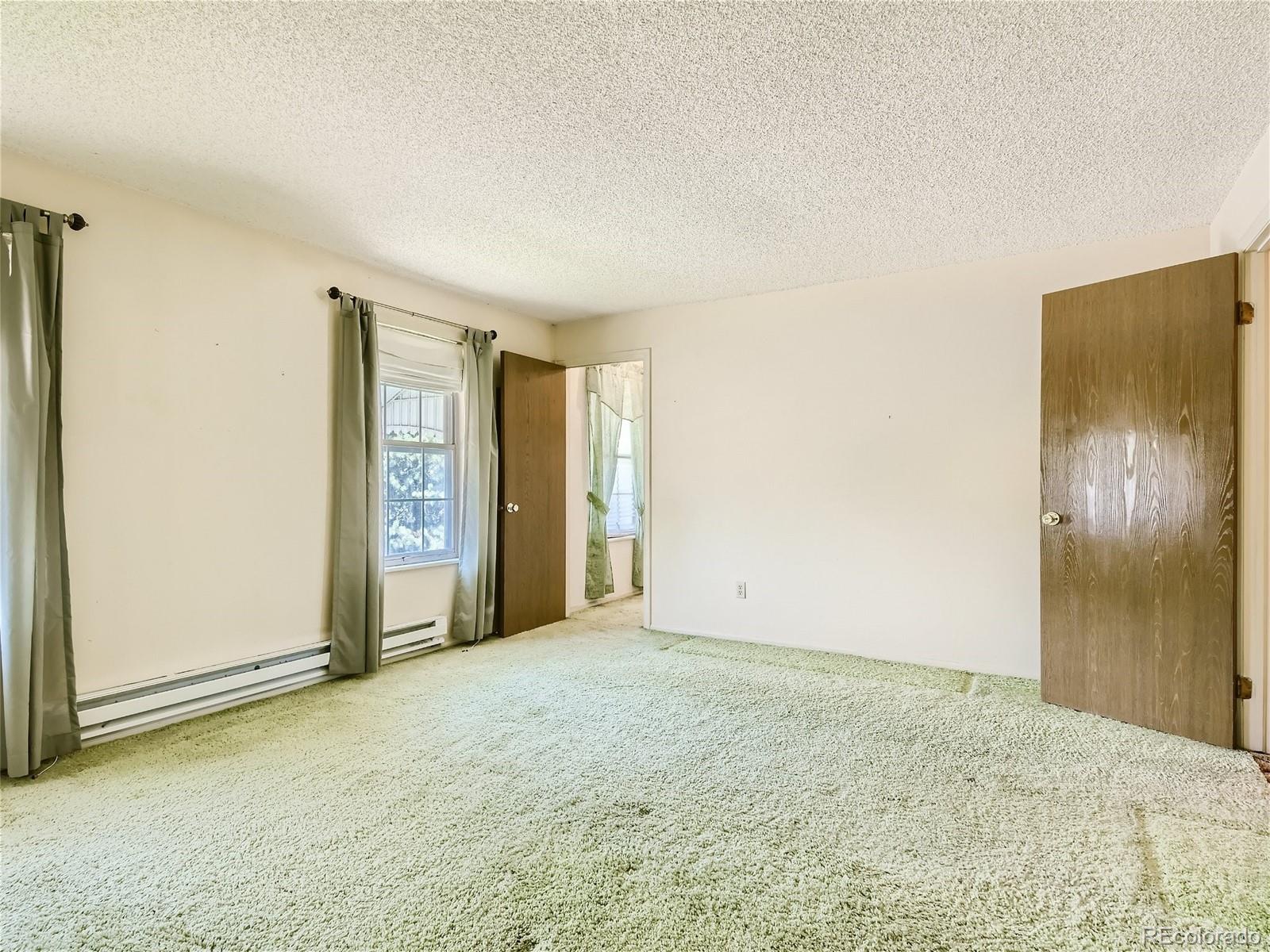 11090 Eudora Way Thornton, CO 80233 - Photo 18 of 28 a view of an empty room and window