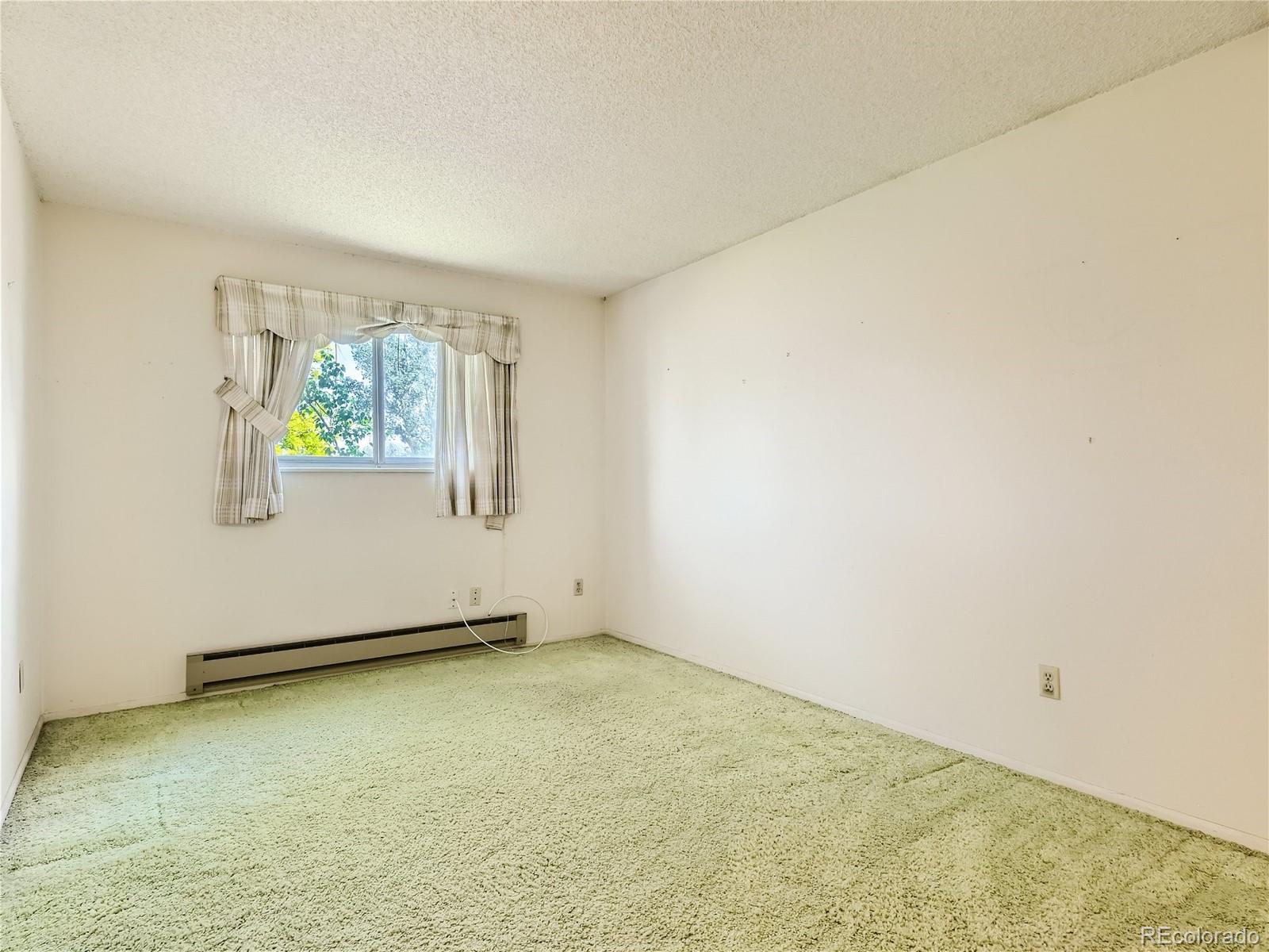 11090 Eudora Way Thornton, CO 80233 - Photo 20 of 28 an empty room with windows