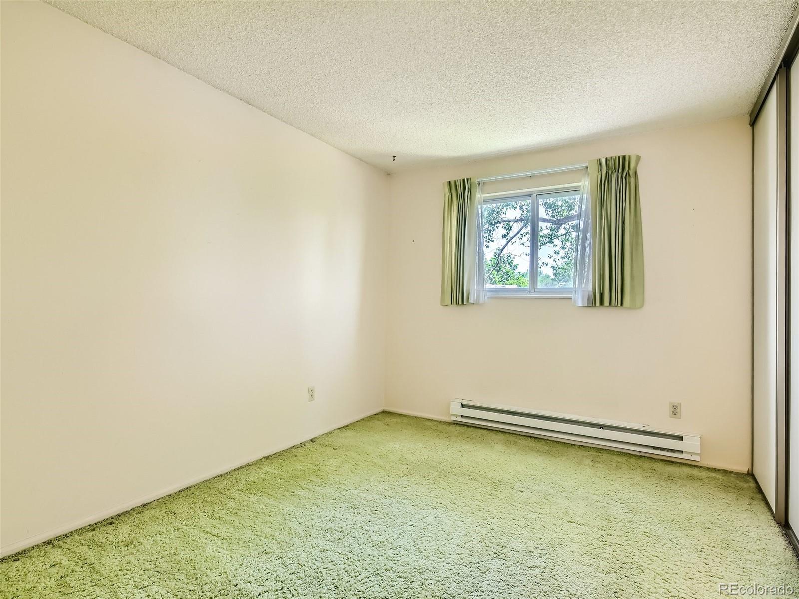 11090 Eudora Way Thornton, CO 80233 - Photo 21 of 28 an empty room with a window