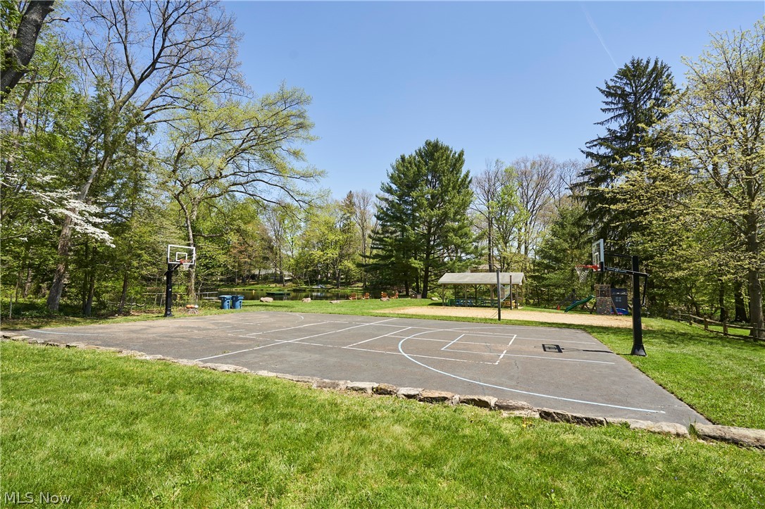 1535 Belle Meade Drive Akron, OH 44321 - Photo 33 of 33 Arrowhead Lake Community boasts a swimming/fishing lake, volleyball court, basketball court, and a designated picnic area, offering residents and visitors a variety of recreational opportunities.
