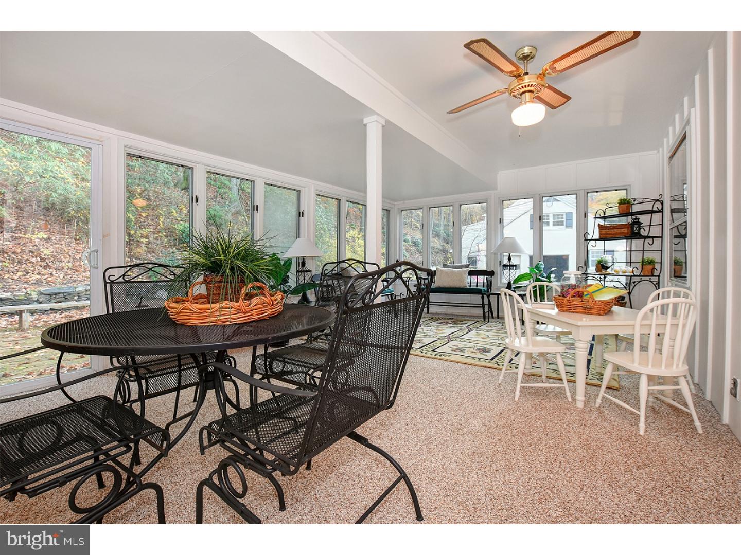 751 Mancill Road Wayne, PA 19087 - Photo 14 of 20 a view of a dining room with furniture and a large window