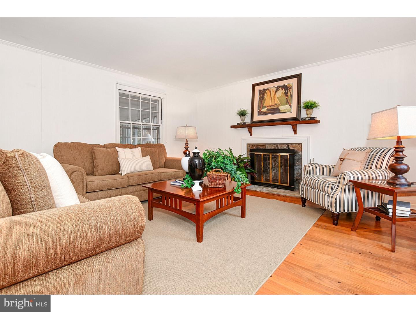 751 Mancill Road Wayne, PA 19087 - Photo 5 of 20 a living room with furniture and a fireplace