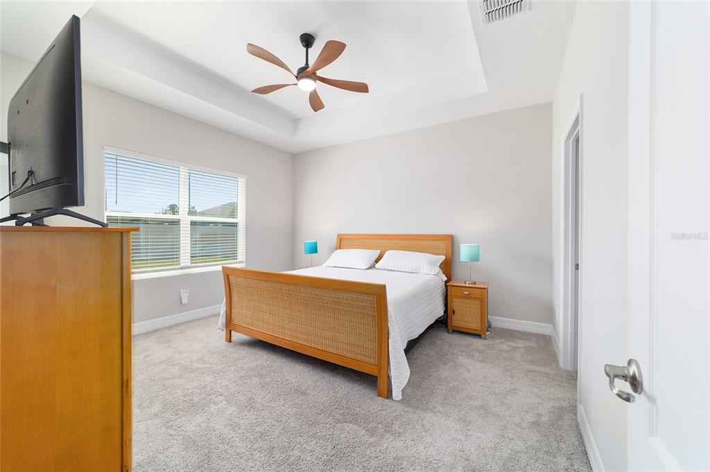 4838 Southwest 130th Street Ocala, FL 34473 - Photo 20 of 48 a blue bed sitting in a room next to a window