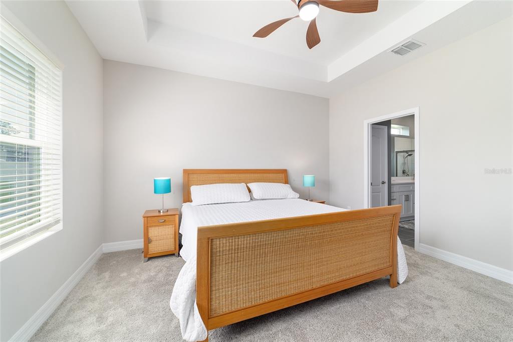 4838 Southwest 130th Street Ocala, FL 34473 - Photo 21 of 48 a bedroom with a bed and window